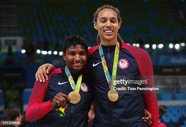 Gold medalists Angel Mccoughtry and Brittney Griner of United States celebrate during the medal ceremony after the Women's Basketball competition on...