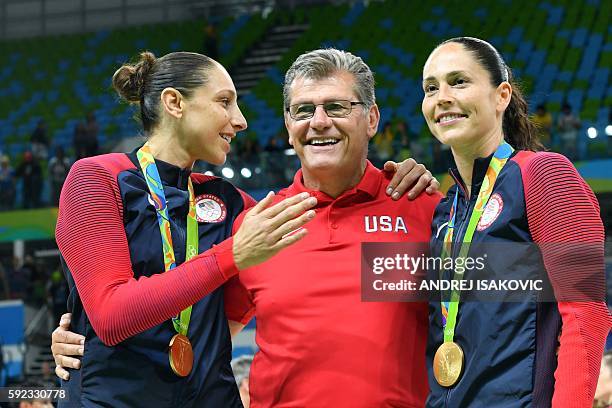 Gold medallists USA's guard Diana Taurasi , USA's head coach Geno Auriemma and USA's guard Sue Bird pose after the final of the Women's basketball...