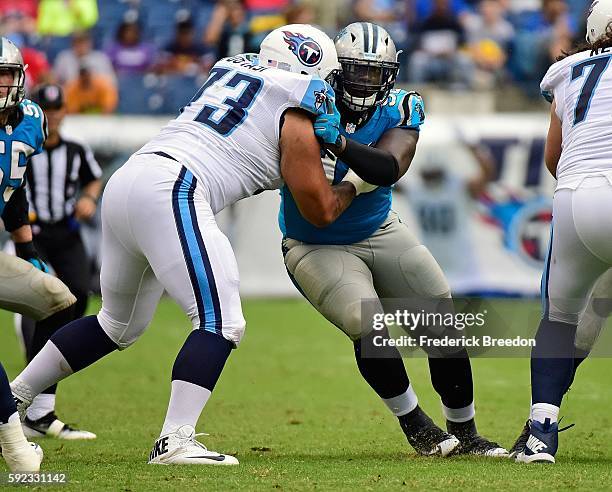 Vernon Butler of the Carolina Panthers is blocked by Jeremiah Poutasi of the Tennessee Titans during the second half at Nissan Stadium on August 20,...