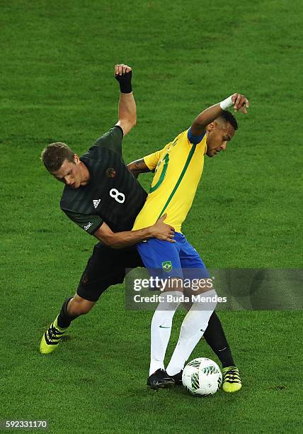 Lars Bender of Germany challenges Neymar of Brazil during the Men's Football Final between Brazil and Germany at the Maracana Stadium on Day 15 of...