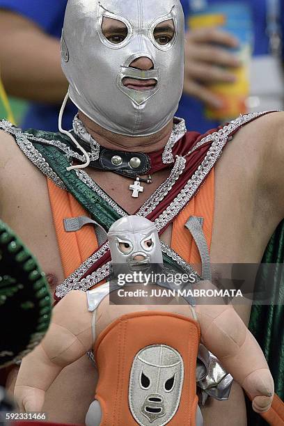 Fan reacts during the Rio 2016 Olympic Games men's football gold medal match between Brazil and Germany at the Maracana stadium in Rio de Janeiro on...