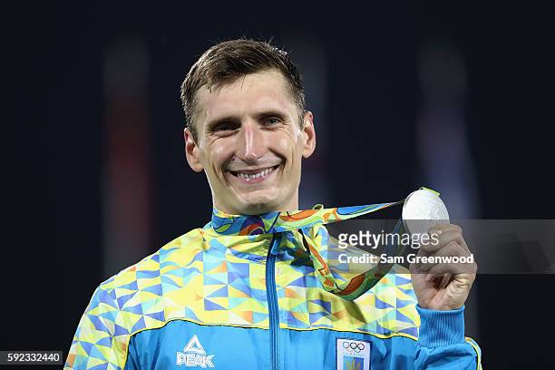 Pavlo Tymoshchenko of Ukraine celebrates on the podium with his Silver medal for the Modern Pentathlon on Day 15 of the Rio 2016 Olympic Games at...
