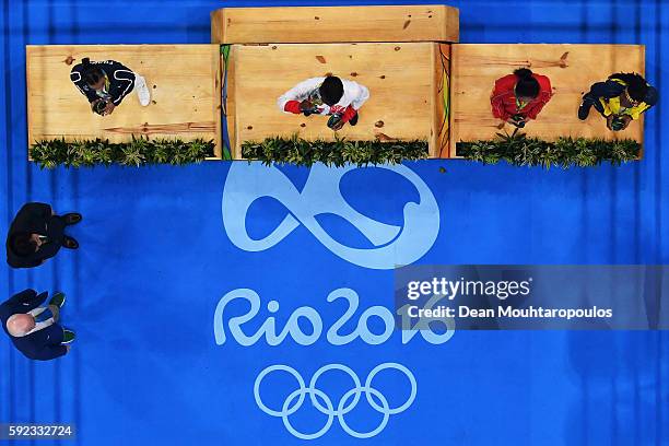 Silver medalist Sarah Ourahmoune of France, gold medalist Nicola Adams of Great Britain and bronze medalists Cancan Ren of China and Ingrit Valencia...