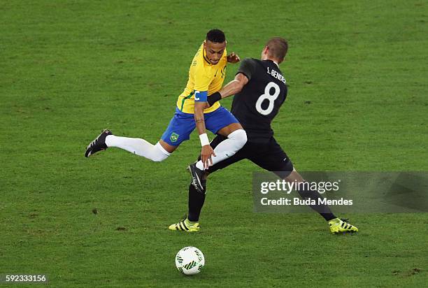 Neymar of Brazil is challenged by Lars Bender of Germany during the Men's Football Final between Brazil and Germany at the Maracana Stadium on Day 15...