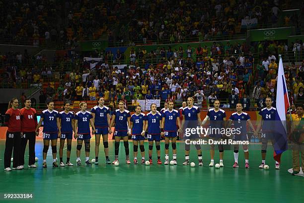 Team of Russia stands for their national anthem during the Women's Handball Gold medal match between France and Russia at Future Arena on Day 15 of...