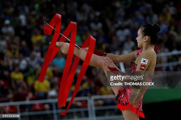 South Korea's Son Yeon Jae competes in the individual all-around final event of the Rhythmic Gymnastics at the Olympic Arena during the Rio 2016...
