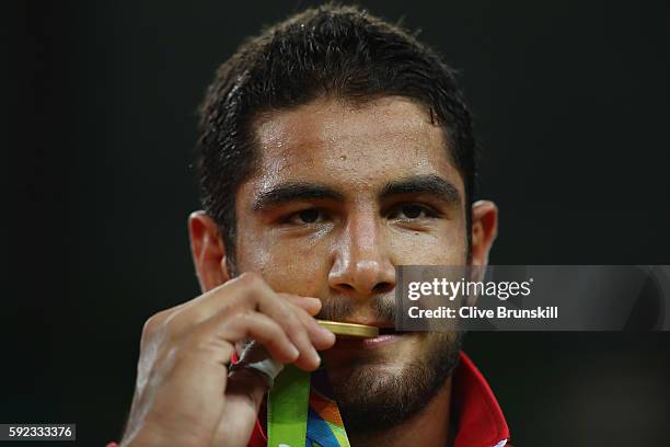 Gold medalist Taha Akgul of Turkey poses on the podium during the medal ceremony for the Men's Freestyle 125kg Wrestling on Day 15 of the Rio 2016...