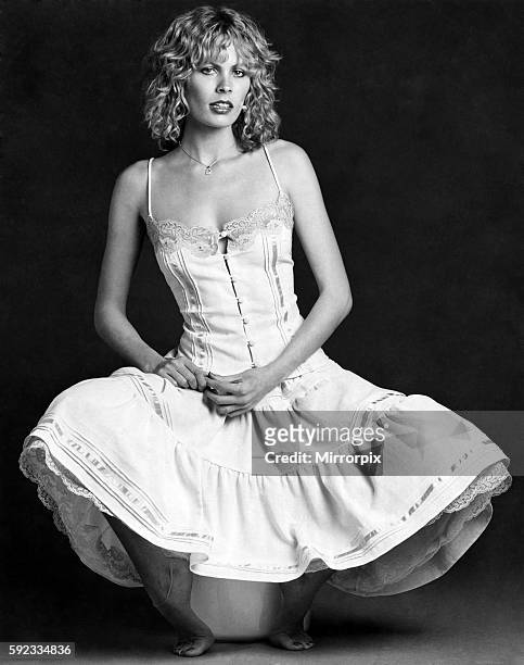Model Diane West, photographed by Doreen Spooner, in a cream Swiss cotton cheesecloth, tiered petticoat with lace and net underskirt. March 1978...