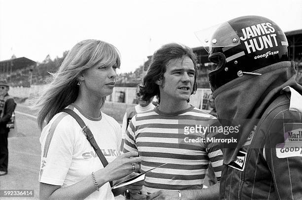 Barry Sheene and his girlfriend Stephanie McLean talking to James Hunt at a practice day for the British Grand Prix held at Brands Hatch, Kent. 17th...