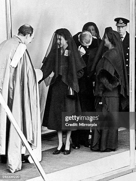 Queen Elizabeth II shakes hands with Eric Hamilton, Dean of Windsor at the funeral of her father King George VI at St George's Chapel, Windsor, 15th...