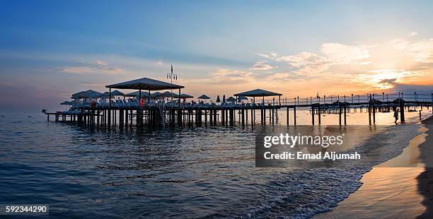 sunset over lara beach, antalya, turkey - antalya coast stock pictures, royalty-free photos & images