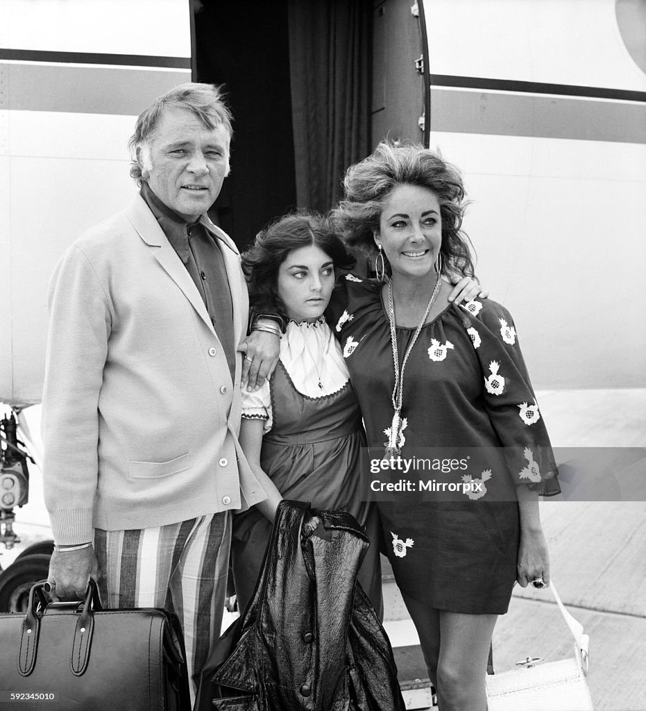 Elizabeth Taylor and Richard Burton with daughter Liza leave London Airport (Heathrow) for Geneva in their private jet t