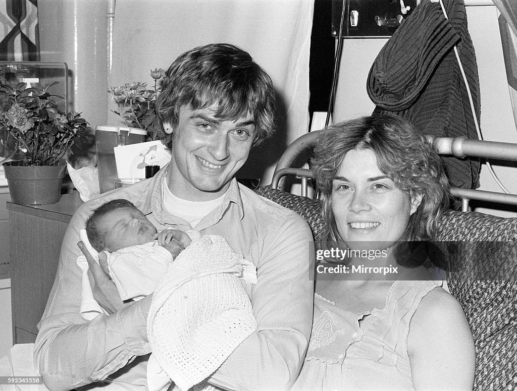 Mike Oldfield, musician and composer, pictured with newborn baby