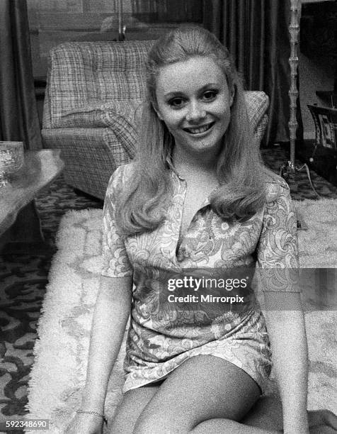 S studios where the goldern shot is made - Ann Aston relaxes in her new flat at West Bromwich Staffs. Blue eyed 22 year old Ann blonde hostess of the...