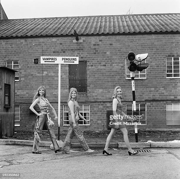 Madeline Smith, Janet Key and Pippa Steel photographed running past a signpost on their way to filming their next movie Forbush and the Penguins at...