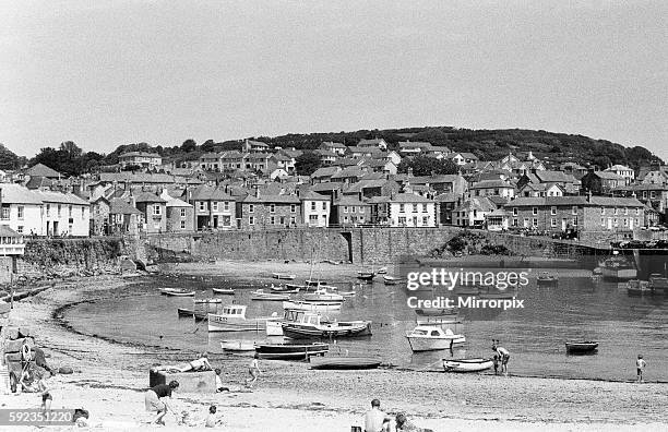 Mousehole Harbour. Mousehole is a village and fishing port in Cornwall, England. It is situated approximately 2.5 miles south of Penzance on the...