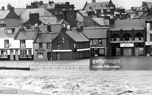 Main street in Whitesands, Dumfries, flooded when the Rover Nith burst its banks and swirled into shops, houses and pubs, 30th January 1974.