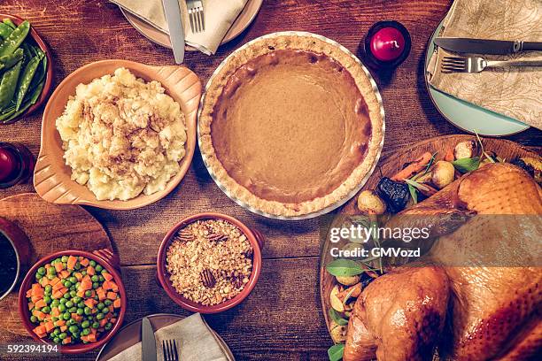 traditional stuffed turkey holiday dinner with vegetables and pumpkin pie - christmas mince pies stock pictures, royalty-free photos & images