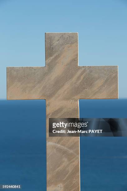 marble crosses above the horizon and the sea - jean marc payet stockfoto's en -beelden