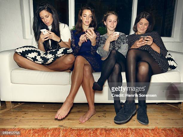 group of young people having a party - black women in tights stockfoto's en -beelden