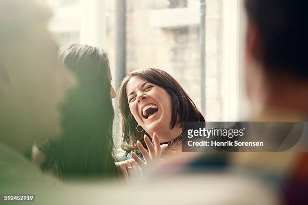 group of young people having a party - laughing woman ストックフォトと画像