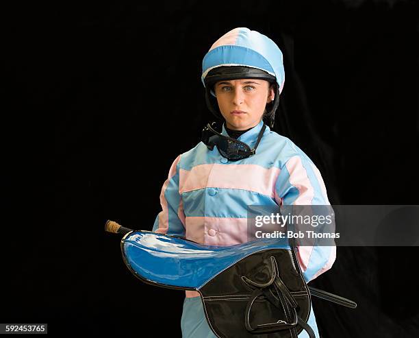 female jockey with saddle and helmet - racing silks fotografías e imágenes de stock