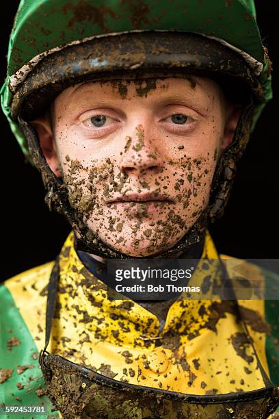 jockey with mud splattered face - mud splatter stock pictures, royalty-free photos & images