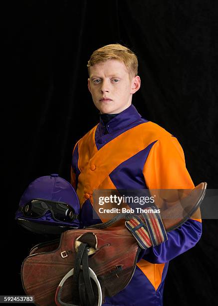 jockey with saddle and helmet - jockey stock pictures, royalty-free photos & images