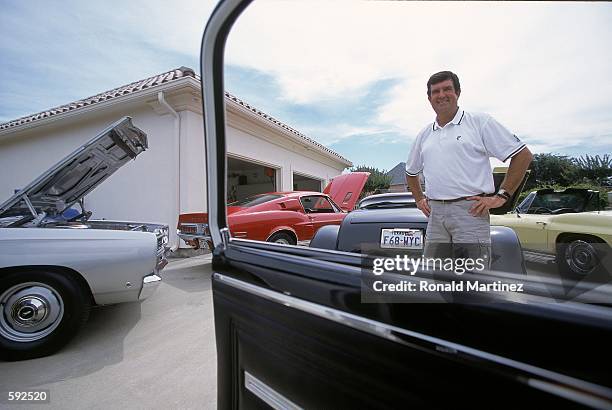 Bruce Lietzke poses with his car collection at his home in Plano, Texas.Mandatory Credit: Ronald Martinez /Allsport