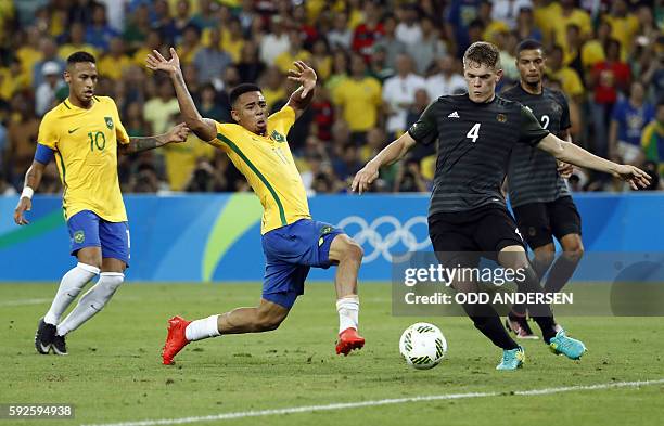 Brazil's forward Gabriel Jesus and Germany's defender Matthias Ginter vie for the ball during the Rio 2016 Olympic Games men's football gold medal...