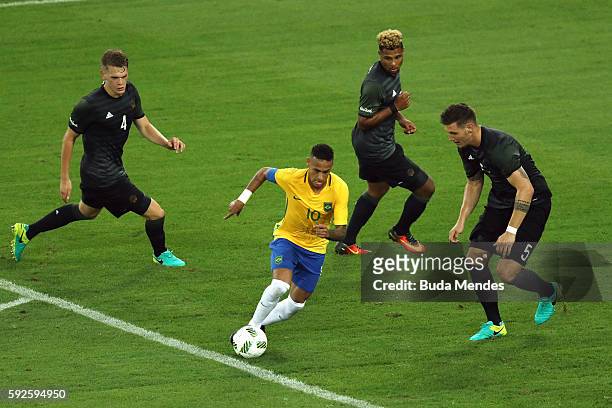 Neymar of Brazil in action surrounded by Matthias Lukas Ginter of Germany, Niklas Suele of Germany and Serge Gnabry of Germany during the Men's...