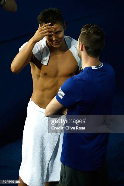 Silver medalist German Sanchez of Mexico celebrates with Bronze medalist David Boudia of the United States after the Men's Diving 10m Platform on Day...