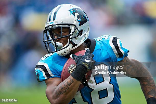 Damiere Byrd of the Carolina Panthers runs with the ball after catching a pass during a preseason game against the Tennessee Titans at Nissan Stadium...