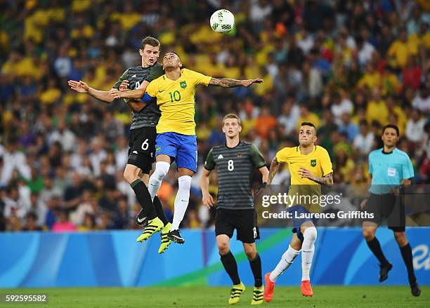 Neymar of Brazil and Sven Bender of Germany compete during the Men's Football Final between Brazil and Germany at the Maracana Stadium on Day 15 of...