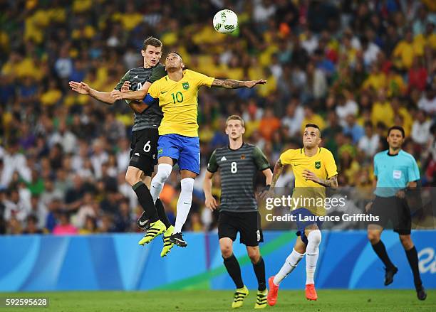 Sven Bender of Germany and Neymar of Brazil challenge for the ball in the air during the Men's Football Final between Brazil and Germany at the...