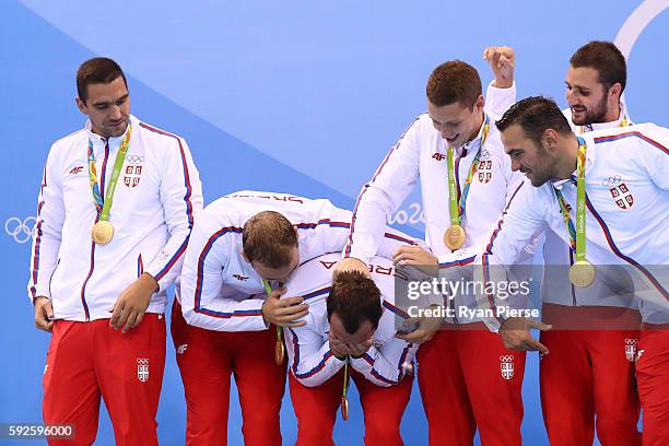 Gold medalists Team Serbia celebrate on the podium during the medal ceremony for the Men's Water Polo Gold Medal match between Croatia and Serbia on...