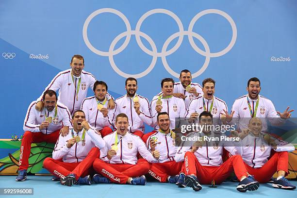 Gold medalists Team Serbia celebrate on the podium during the medal ceremony for the Men's Water Polo Gold Medal match between Croatia and Serbia on...