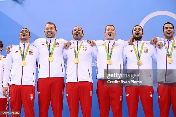 Gold medalists Team Serbia celebrate on the podium during the medal ceremony for the Men's Water Polo Gold Medal match between Croatia and Serbia on...