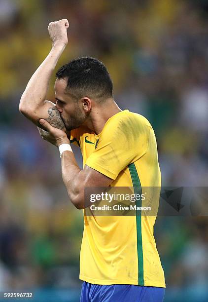 Marquinhos of Brazil reacts after scoring his penalty in the penalty shoot out during the Men's Football Final between Brazil and Germany at the...