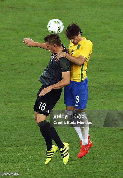 Nils Petersen of Germany and Rodrigo Caio of Brazil during the Men's Football Final between Brazil and Germany at the Maracana Stadium on Day 15 of...