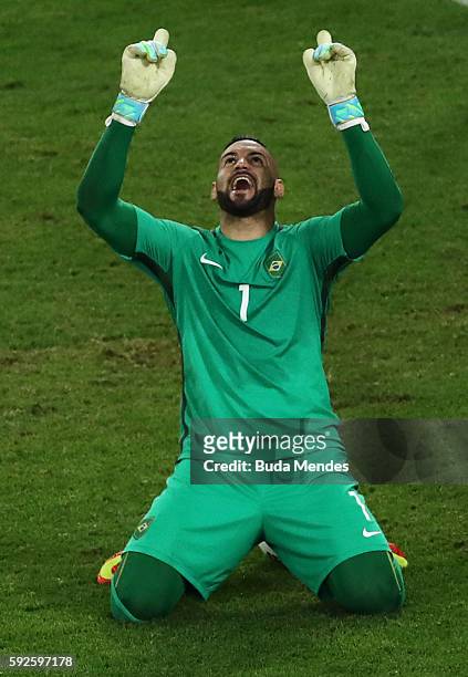 Weverton the Brazil goalkeeper saves the penalty taken by Nils Petersen of Germany during the penalty shoot out in the Men's Football Final between...