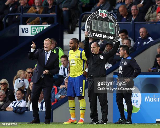 Everton manager Ronald Koeman with substitute Ashley Williams as 4th Official Scott Duncan uses the Tag Heuer Board during the Premier League match...