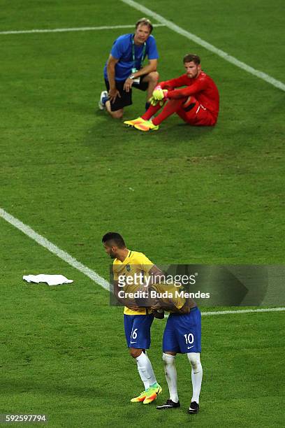 Neymar of Brazil celebrates with team mate Thiago Maia of Brazil after scoring the winning penalty in the penalty shoot out as German keeper Timo...