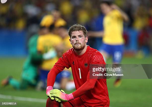 Timo Horn of Germany reacts as Neymar of Brazil scores the winning penalty in the penalty shoot out during the Men's Football Final between Brazil...