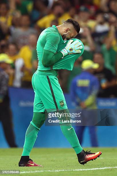Weverton the Brazil goalkeeper celebrates as Brazil win the penalty shoot out in the Men's Football Final between Brazil and Germany at the Maracana...