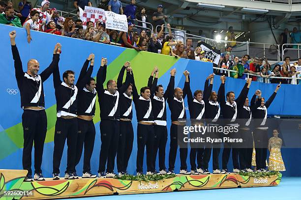 Bronze medalists Team Italy celebrate on the podium during the medal ceremony for the Men's Water Polo Gold Medal match between Croatia and Serbia on...