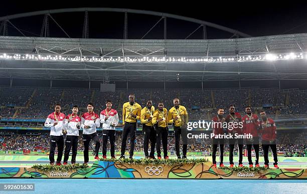 Silver medalists Japan, gold medalists Jamaica and bronze medalists Canada stand on the podium during the medal ceremony for the Men's 4 x 100 meter...