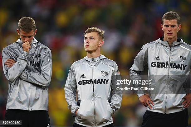 Team captain Maximilian Meyer and German team mates look despondent after their defeat during the Men's Football Final between Brazil and Germany at...