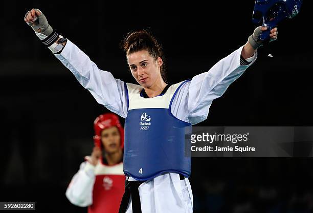 Bianca Walkden of Great Britain celebrates after defeating Wiam Dislam of Morocco during the Women's +67kg Bronze Medal contest on Day 15 of the Rio...