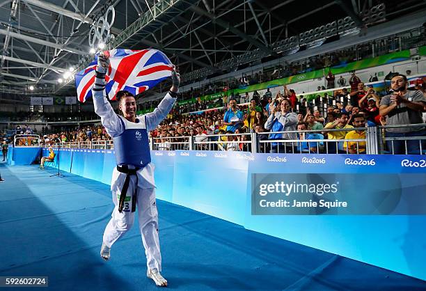 Bianca Walkden of Great Britain celebrates after defeating Wiam Dislam of Morocco during the Women's +67kg Bronze Medal contest on Day 15 of the Rio...